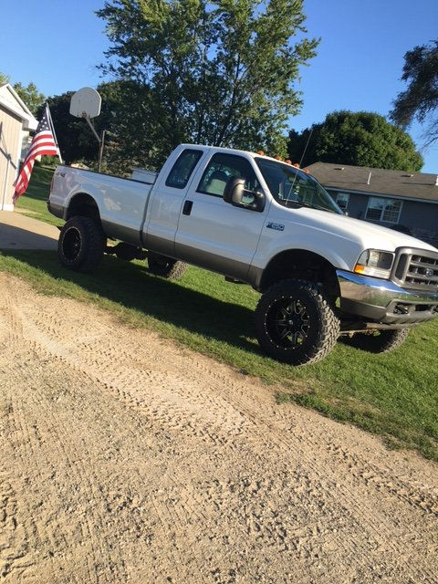 Lifted F250 with 20x12 Mavericks